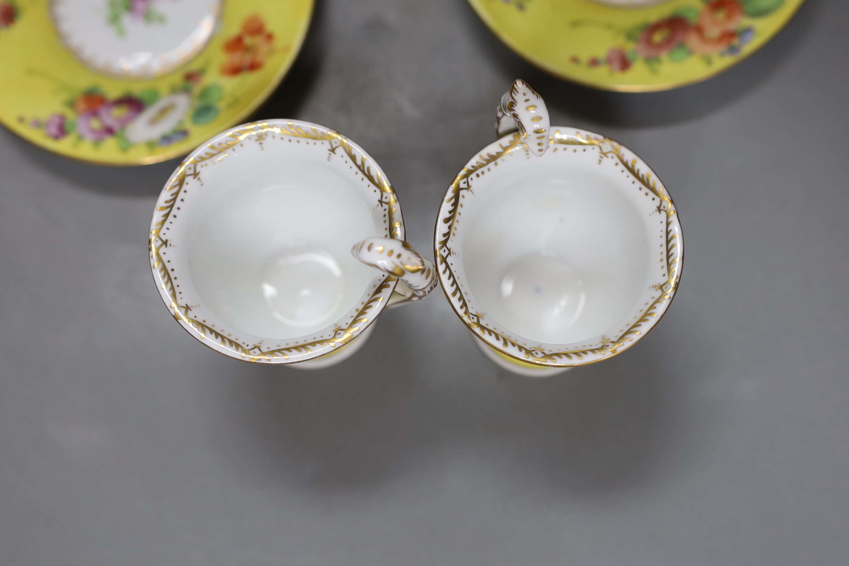 A set of four Dresden yellow ground cups and saucers